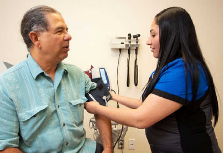 A person getting their blood pressure checked at Amador Health Center